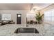 Bright open kitchen with a large sink and granite countertop bar at 20 S Eugenia Nw Pl, Atlanta, GA 30318