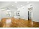 Spacious open floor plan featuring hardwood floors, recessed lighting, and modern kitchen at 20 S Eugenia Nw Pl, Atlanta, GA 30318