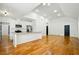 Bright and open-concept living space with modern kitchen and hardwood floors at 20 S Eugenia Nw Pl, Atlanta, GA 30318