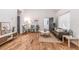 Spacious and inviting living room with hardwood floors, a cozy sofa, and abundant natural light at 20 S Eugenia Nw Pl, Atlanta, GA 30318