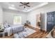 Spacious main bedroom with hardwood floors, en-suite bathroom and private deck at 20 S Eugenia Nw Pl, Atlanta, GA 30318