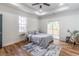 Bedroom with ceiling fan, neutral colors, and door to outdoor balcony at 20 S Eugenia Nw Pl, Atlanta, GA 30318
