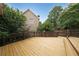 Multi-level back deck with railings overlooking fenced yard at 2747 Harper Woods Dr, Marietta, GA 30062