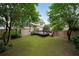 Backyard showcasing a wooden deck and lush greenery, perfect for outdoor living at 2747 Harper Woods Dr, Marietta, GA 30062