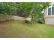 Large backyard featuring a well-maintained lawn and a wooden fence for privacy at 2747 Harper Woods Dr, Marietta, GA 30062