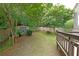 A fenced backyard with mature trees and a storage shed at 2747 Harper Woods Dr, Marietta, GA 30062