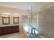 A primary bathroom with a tub, double sinks, and a glass-enclosed shower at 2747 Harper Woods Dr, Marietta, GA 30062