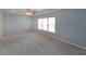 Spacious bedroom with large windows, ceiling fan and plush carpeting at 2747 Harper Woods Dr, Marietta, GA 30062
