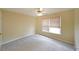 Comfortable bedroom with a ceiling fan, plush carpet, and a large window at 2747 Harper Woods Dr, Marietta, GA 30062