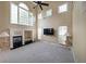 Open living room featuring high ceilings, fireplace, large windows, and neutral paint at 2747 Harper Woods Dr, Marietta, GA 30062