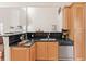 Kitchen with stainless steel appliances, and a black tiled backsplash at 3113 Brians Creek Se Dr, Conyers, GA 30013