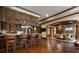 Entertainers bar featuring custom cabinets, bar seating, and views into the cozy living room at 3155 Wills Mill Rd, Cumming, GA 30041