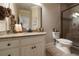 Bathroom featuring a granite vanity, toilet, and shower with glass door at 3155 Wills Mill Rd, Cumming, GA 30041