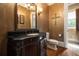 This bathroom boasts a custom vanity, decorative wall art, and elegant lighting, offering a luxurious experience at 3155 Wills Mill Rd, Cumming, GA 30041