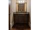 Bathroom vanity featuring a granite countertop, sink, dark wood cabinetry, and framed mirror at 3155 Wills Mill Rd, Cumming, GA 30041