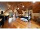 Spacious bedroom with wood-paneled ceiling, hardwood floors and white daybed at 3155 Wills Mill Rd, Cumming, GA 30041