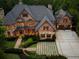 Stunning brick and stone home with meticulously landscaped grounds and three car garage at 3155 Wills Mill Rd, Cumming, GA 30041