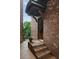 Charming brick front entrance with steps leading up to a covered doorway and black metal gate at 3155 Wills Mill Rd, Cumming, GA 30041