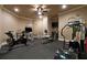 A home gym featuring a variety of exercise equipment and rubber flooring at 3155 Wills Mill Rd, Cumming, GA 30041