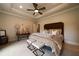 Spacious main bedroom with a trey ceiling and neutral decor at 3155 Wills Mill Rd, Cumming, GA 30041