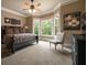 The main bedroom is light and bright with a large bay window and neutral colors, creating a peaceful retreat at 3155 Wills Mill Rd, Cumming, GA 30041