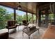 Covered outdoor patio with ceiling fan and outdoor furniture at 3155 Wills Mill Rd, Cumming, GA 30041