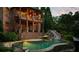 Beautiful backyard with a multi-level pool, slide, and waterfall features at 3155 Wills Mill Rd, Cumming, GA 30041