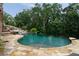 Beautiful swimming pool and mature trees offer a private backyard oasis at 3155 Wills Mill Rd, Cumming, GA 30041