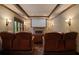 A home theater with reclining leather chairs and a projection screen at 3155 Wills Mill Rd, Cumming, GA 30041