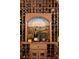 A wine cellar featuring labeled wines, custom racking and artistic detail at 3155 Wills Mill Rd, Cumming, GA 30041