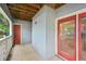 Outdoor balcony with red door and wood paneled ceiling at 514 Mcgill Ne Pl, Atlanta, GA 30312