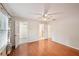 Bedroom with wood-look floors and a closet, featuring a ceiling fan and lots of natural light at 514 Mcgill Ne Pl, Atlanta, GA 30312