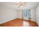 Bedroom with wood-look floors and a window with curtains, featuring a ceiling fan at 514 Mcgill Ne Pl, Atlanta, GA 30312