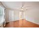 Bedroom with wood-look floors and a window with blinds, featuring a ceiling fan at 514 Mcgill Ne Pl, Atlanta, GA 30312