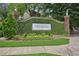 Landscaped entrance to 350 McGill Place with a vine-covered wall and decorative signage at 514 Mcgill Ne Pl, Atlanta, GA 30312