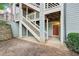 Condo entrance with stairway to upper floors and a red unit door at 514 Mcgill Ne Pl, Atlanta, GA 30312