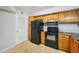 Eat-in kitchen with stainless steel appliances, tile floor, and ample storage at 514 Mcgill Ne Pl, Atlanta, GA 30312