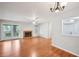 Open living room with wood floors, fireplace, and sliding door to the balcony at 514 Mcgill Ne Pl, Atlanta, GA 30312