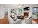Bright living room with hardwood floors, fireplace, and access to a private deck at 514 Mcgill Ne Pl, Atlanta, GA 30312