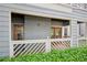 Outdoor patio featuring white railing and a red door in a serene setting at 514 Mcgill Ne Pl, Atlanta, GA 30312
