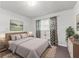 Bright bedroom featuring a queen-size bed, patterned curtains, and natural light at 564 Allana Ct, Stone Mountain, GA 30087