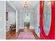 Warm entryway featuring hardwood floors, stylish rug, and a charming chair, welcoming guests into the home at 564 Allana Ct, Stone Mountain, GA 30087