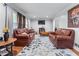 Comfortable living area with fireplace, neutral furniture, and bright lighting creating a cozy atmosphere at 564 Allana Ct, Stone Mountain, GA 30087