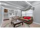 Cozy living room with exposed beams, neutral-toned couches, and access to the stairway at 564 Allana Ct, Stone Mountain, GA 30087