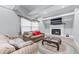 Inviting living room with plush leather seating, decorative rug, and natural light streaming through the windows at 564 Allana Ct, Stone Mountain, GA 30087