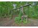 Unique wooden structure and natural landscaping in the backyard at 5770 Dorsett Shoals Rd, Douglasville, GA 30135