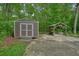 Backyard shed and covered patio area, perfect for outdoor storage and relaxing at 5770 Dorsett Shoals Rd, Douglasville, GA 30135