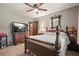 Bedroom featuring ceiling fan and adjacent door at 5770 Dorsett Shoals Rd, Douglasville, GA 30135