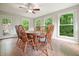 The dining room has backyard views and includes a wooden table with six chairs at 5770 Dorsett Shoals Rd, Douglasville, GA 30135