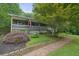 Charming home with a welcoming front yard, landscaped garden, and a brick pathway to the entrance at 5770 Dorsett Shoals Rd, Douglasville, GA 30135